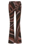 the pucci trousers define a tight silhouette that opens into an elegant flared b