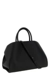 the ferragamo hug m handbag sets new standards of structured luxury through an