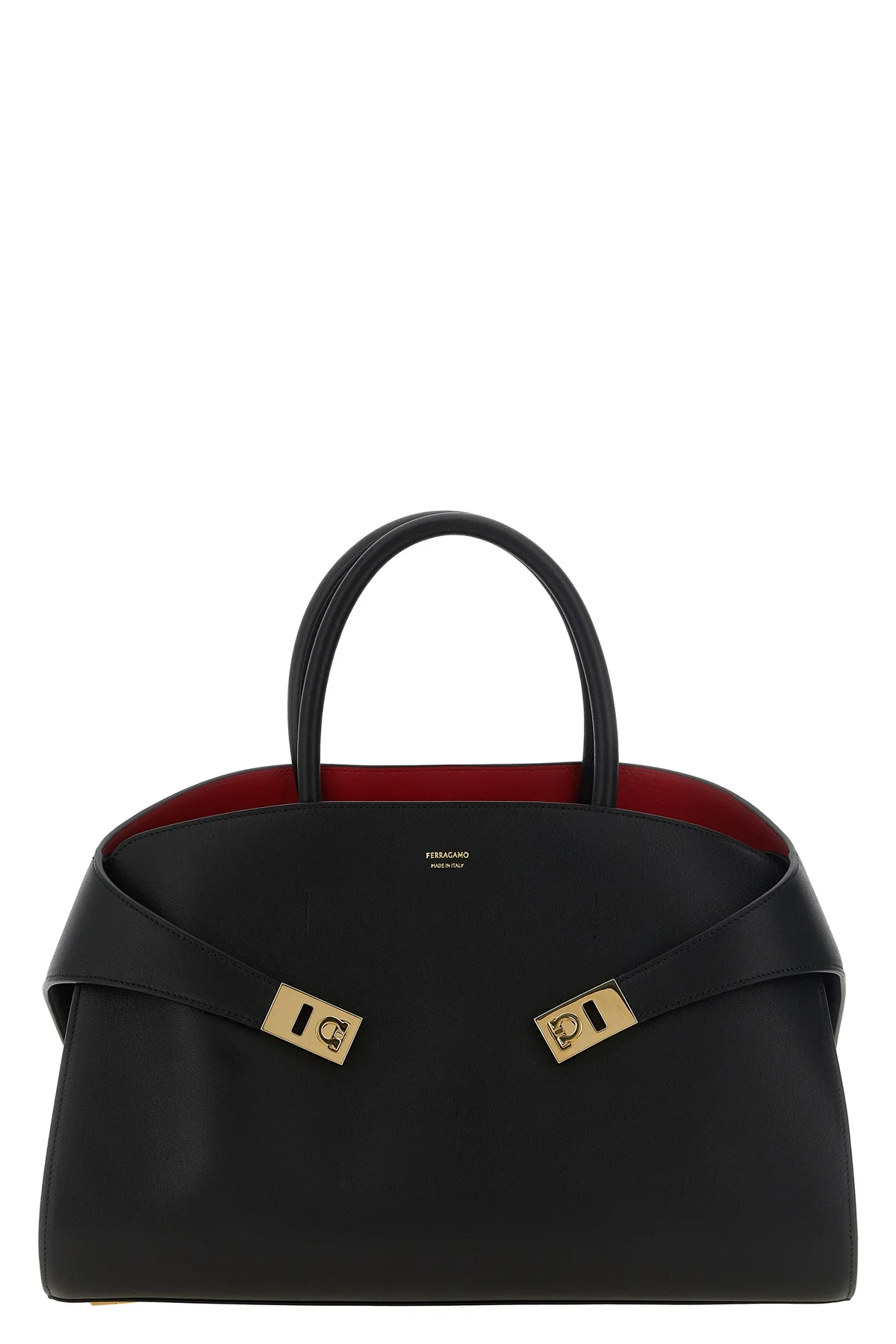 the ferragamo hug m handbag sets new standards of structured luxury through an