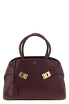 ferragamos hug (m) handbag in fine burgundy hammered calf leather stands out