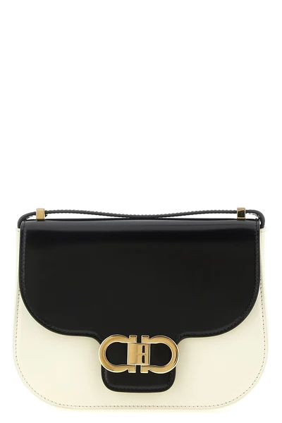 the ferragamo north-south double gancini (xs) crossbody bag defines a rigorous