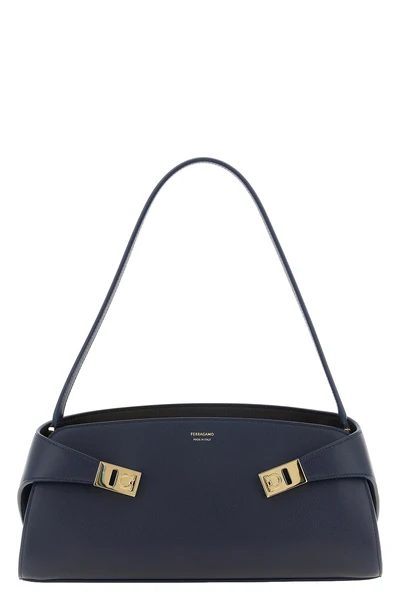 the ferragamo hug east-west shoulder bag stands out for its structured silhoue