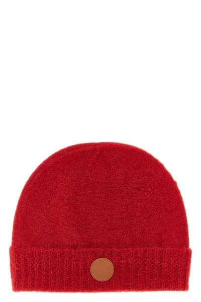 the vivienne westwood cap redefines winter accessories through a rich and envelo