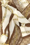 the gucci scarf redefines archival codes through a diamond silhouette