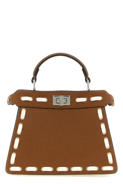 the fendi peekaboo iseeu handbag is made of brown cuoio romano leather