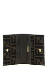 the fendi cardholder is distinguished by a compact folding construction