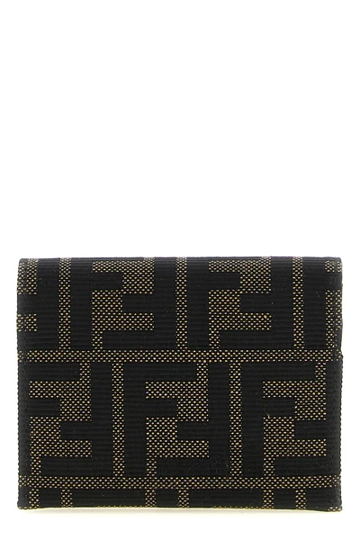 the fendi cardholder is distinguished by a compact folding construction