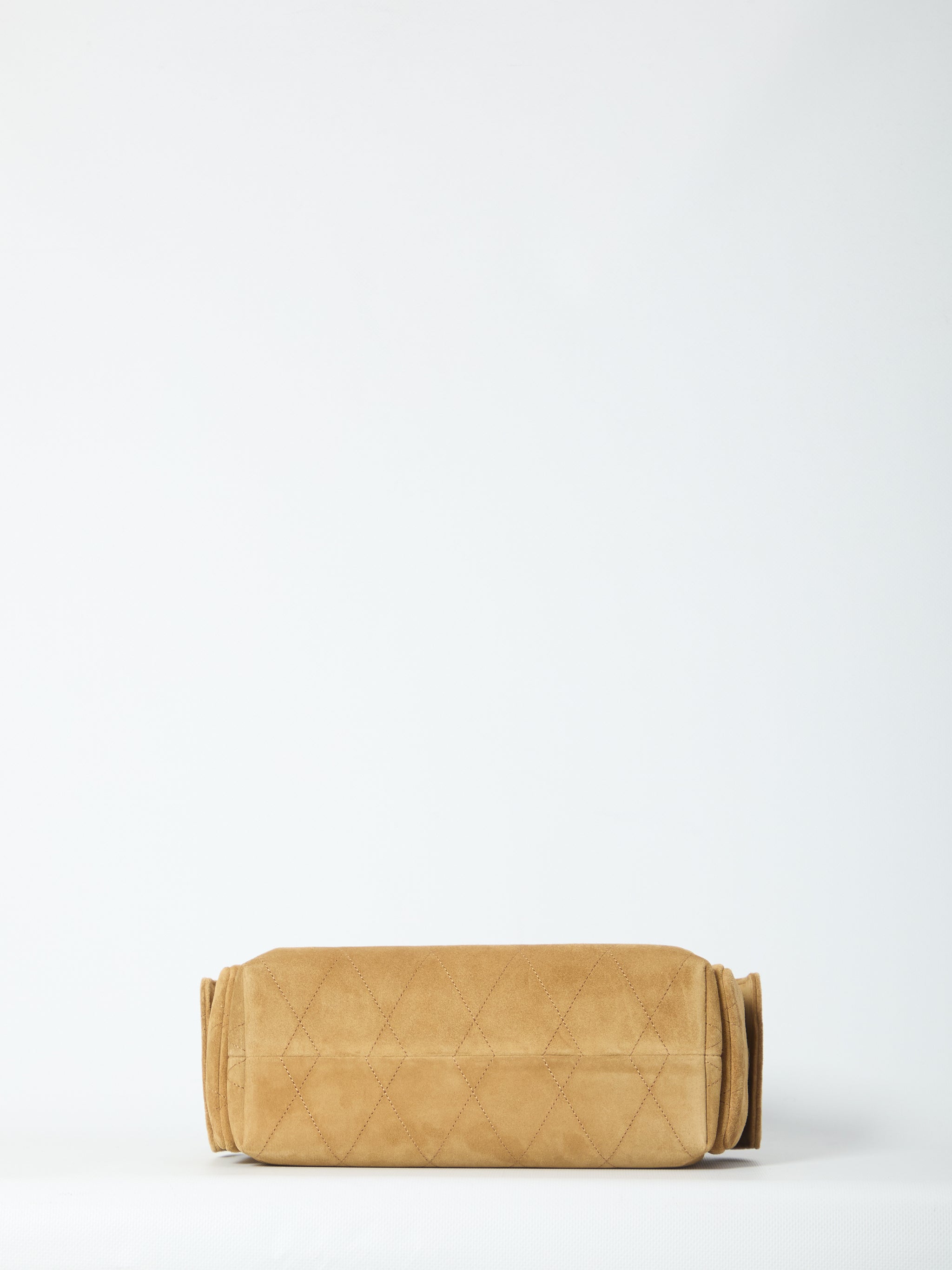 charlie quilted suede drawstring bag