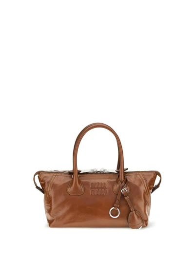 glossy leather handbag