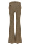 saint laurent flared trousers redefine classic tailoring through a silhouette in