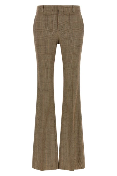 saint laurent flared trousers redefine classic tailoring through a silhouette in