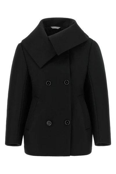 the balenciaga black short caban redefines classic proportions through a rigorou