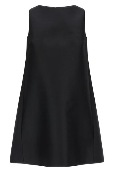 the flared balenciaga dress defines an essential silhouette through rigorous geo