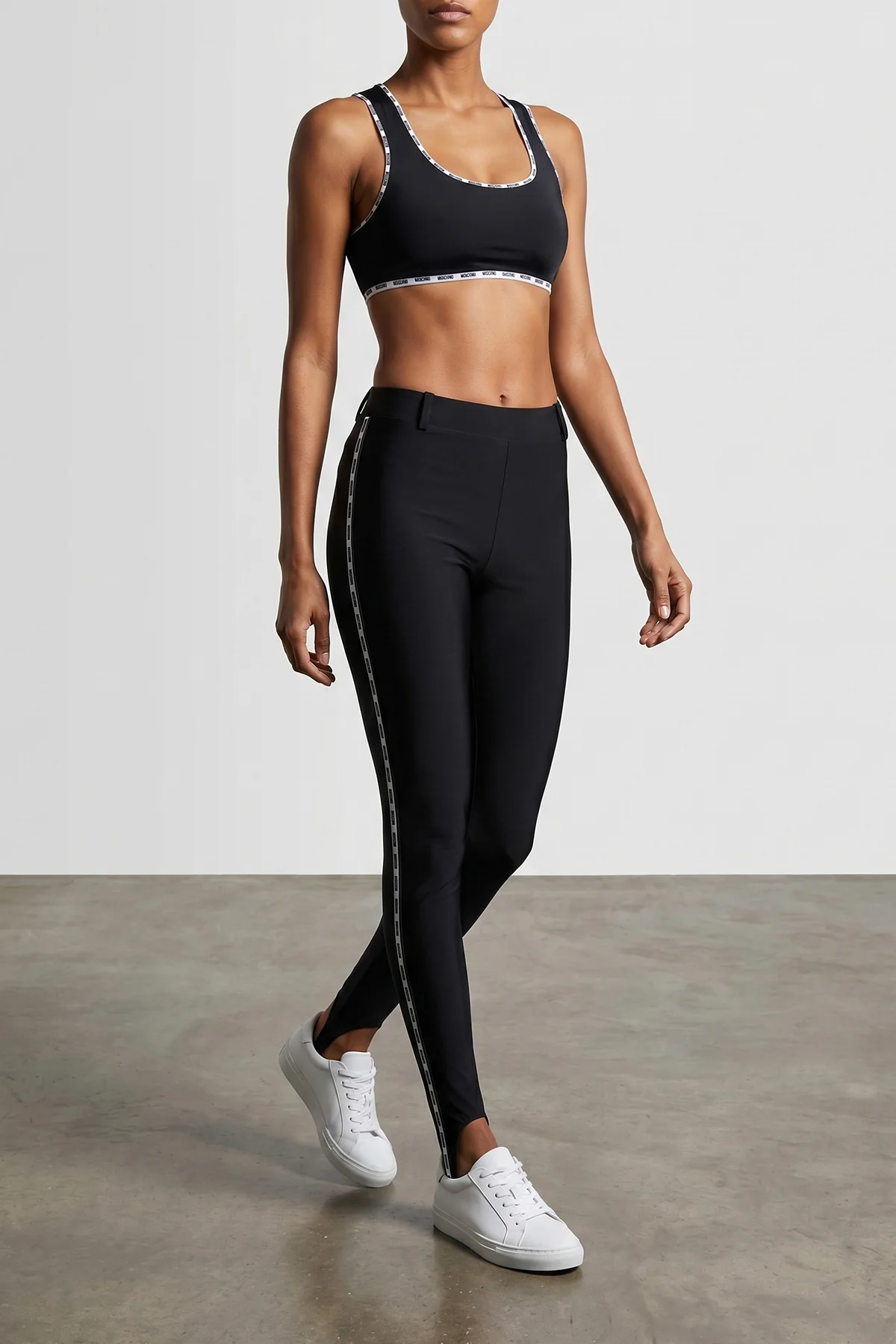 MOSCHINO 38 moschinos black leggings define the silhouette through a stretch lycra construc