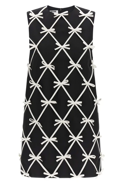 moschinos mini dress redefines the trapezoid silhouette through a sartorial con