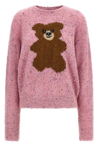 the moschino teddy bear jersey stands out for a complex bouclé workmanship that