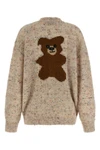 the moschino cardigan redefines contemporary knitwear through a sophisticated bo