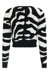 the moschino jersey redefines contemporary knitwear through a bold visual narrat