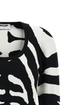 the moschino jersey redefines contemporary knitwear through a bold visual narrat