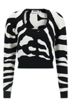 the moschino jersey redefines contemporary knitwear through a bold visual narrat