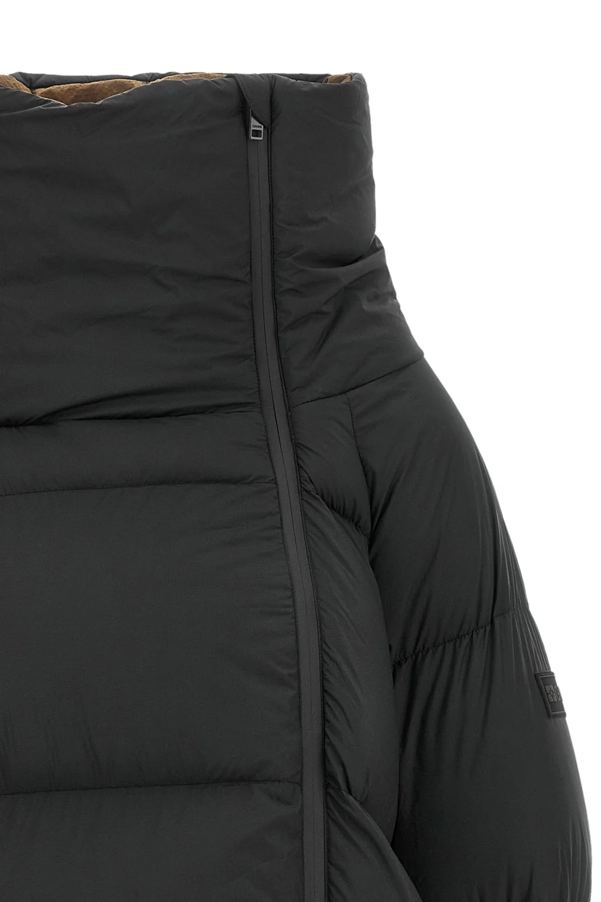 the black ganni down jacket is distinguished by a voluminous silhouette and asym