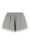 the ganni isoli shorts redefine casual style through a precise balance of text