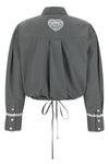 the ganni cropped shirt reinterprets the classic silhouette through shortened pr