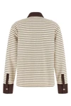 the long-sleeved polo shirt ganni redefines casual dress codes through meticulou
