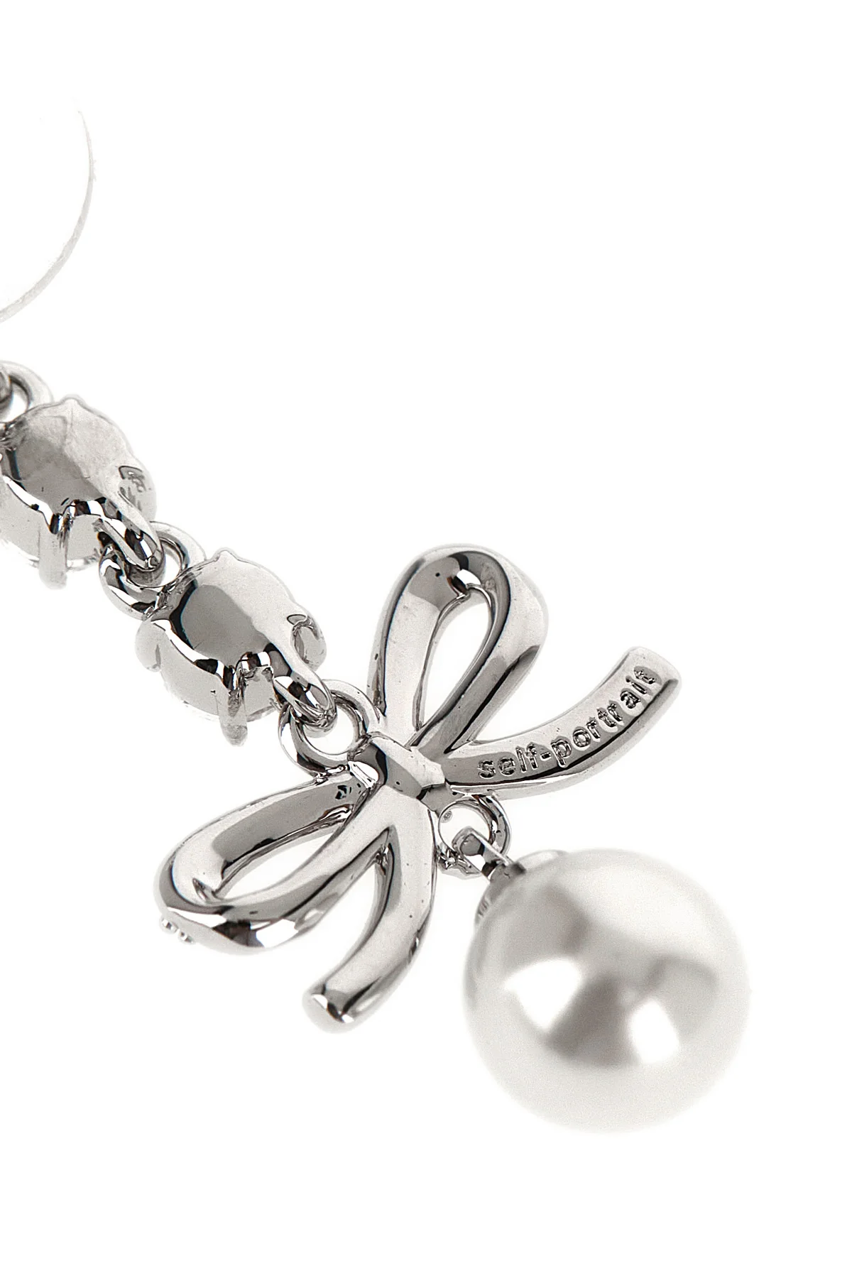 SELF PORTRAIT OS the self-portrait bow crystal charm pendant earrings feature a cascading metal