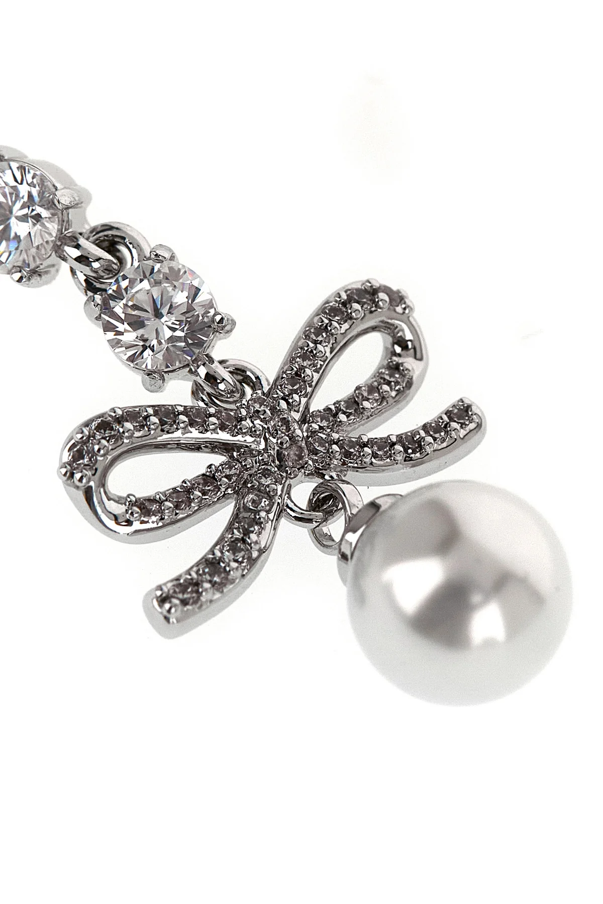 the self-portrait bow crystal charm pendant earrings feature a cascading metal