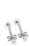 the self-portrait bow crystal charm pendant earrings feature a cascading metal
