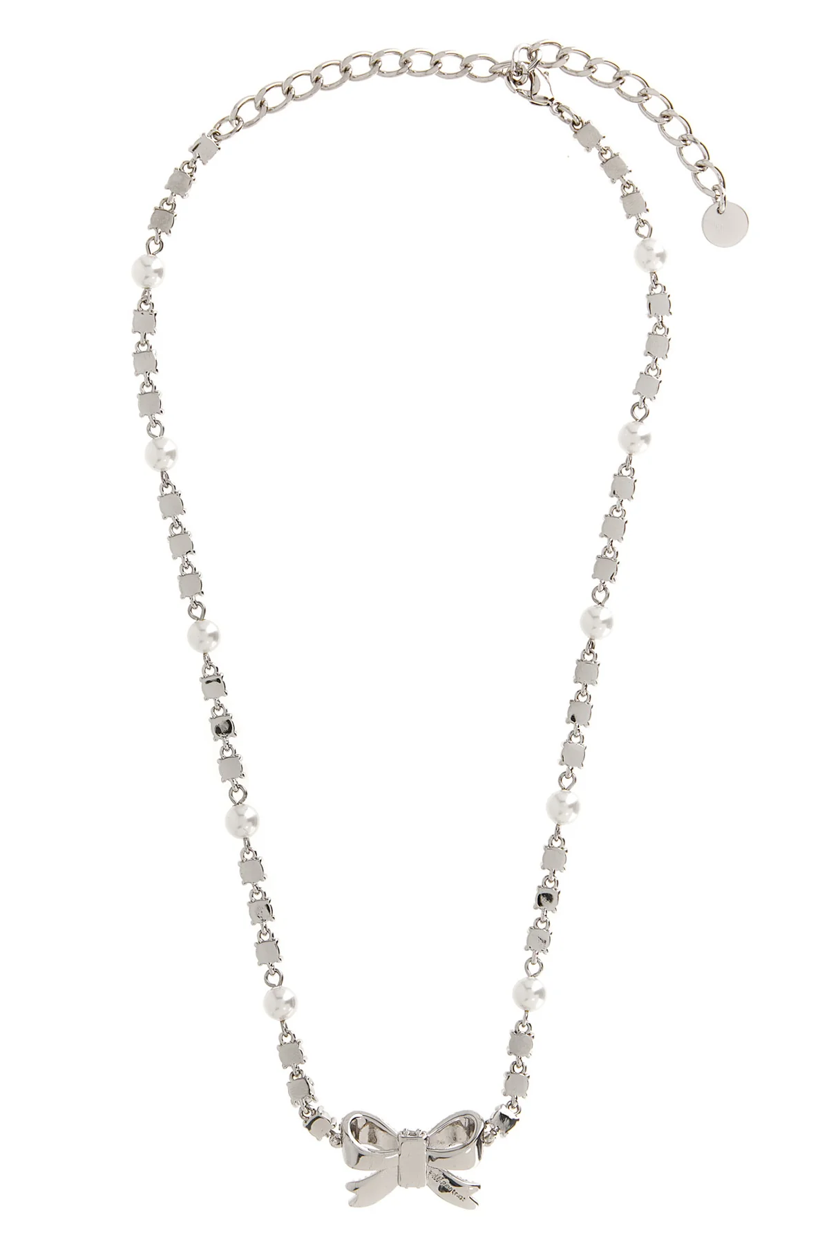 the self-portrait crystal pearl bow necklace defines the décolleté through a r