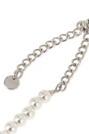the black bow pearl necklace by self-portrait is structured on a continuous th