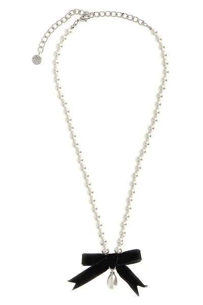 the black bow pearl necklace by self-portrait is structured on a continuous th