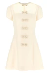 the valentino garavani mini dress expresses a refined sartorial vision through a