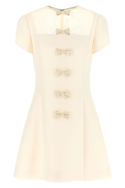 the valentino garavani mini dress expresses a refined sartorial vision through a