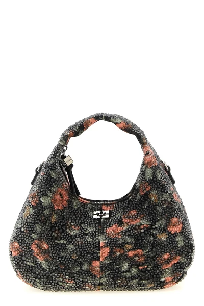 the hobo mini flowers ganni bag redefines the classic curved silhouette throug