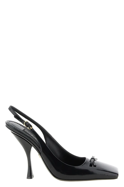 the dolce gabbana slingback in black shiny calf leather defines the silhouette