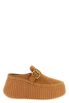 nama chloe sabots redefine the volumes of contemporary footwear through a slip-o