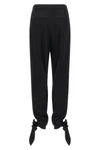 chloé trousers redefine contemporary tailoring through fluid volumes and unexpec