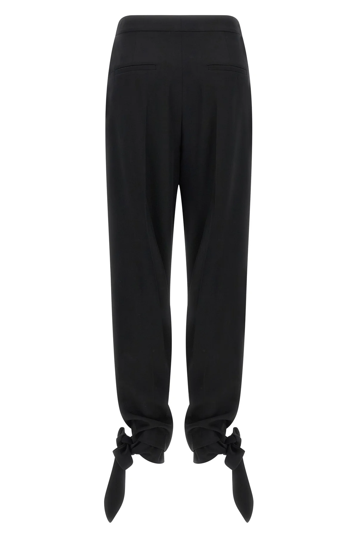 chloé trousers redefine contemporary tailoring through fluid volumes and unexpec