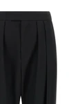 chloé trousers redefine contemporary tailoring through fluid volumes and unexpec
