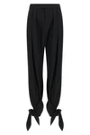 chloé trousers redefine contemporary tailoring through fluid volumes and unexpec