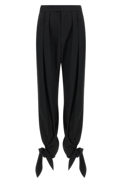 chloé trousers redefine contemporary tailoring through fluid volumes and unexpec