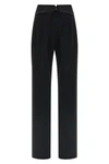 the tuxedo-inspired trousers by ermanno scervino define a slender silhouette thr