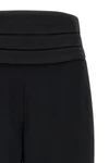 the tuxedo-inspired trousers by ermanno scervino define a slender silhouette thr