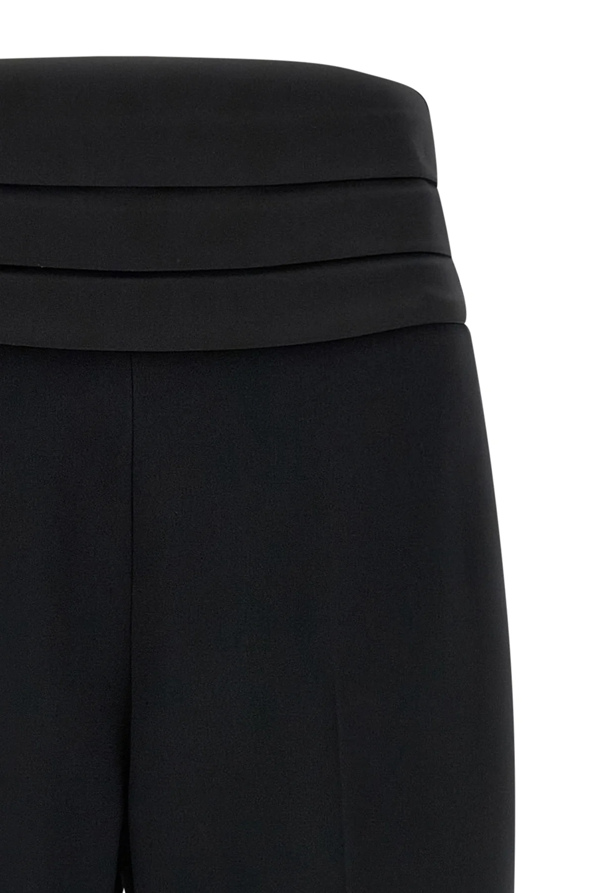 the tuxedo-inspired trousers by ermanno scervino define a slender silhouette thr