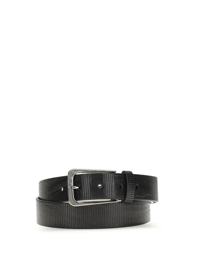 carved leather belt with shimmering buckle