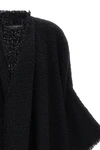 the dolce & gabbana bouclé cape stands out for its large volume