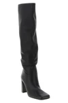 the khaite petra boot redefines vertical elegance through a rigorous silhouett